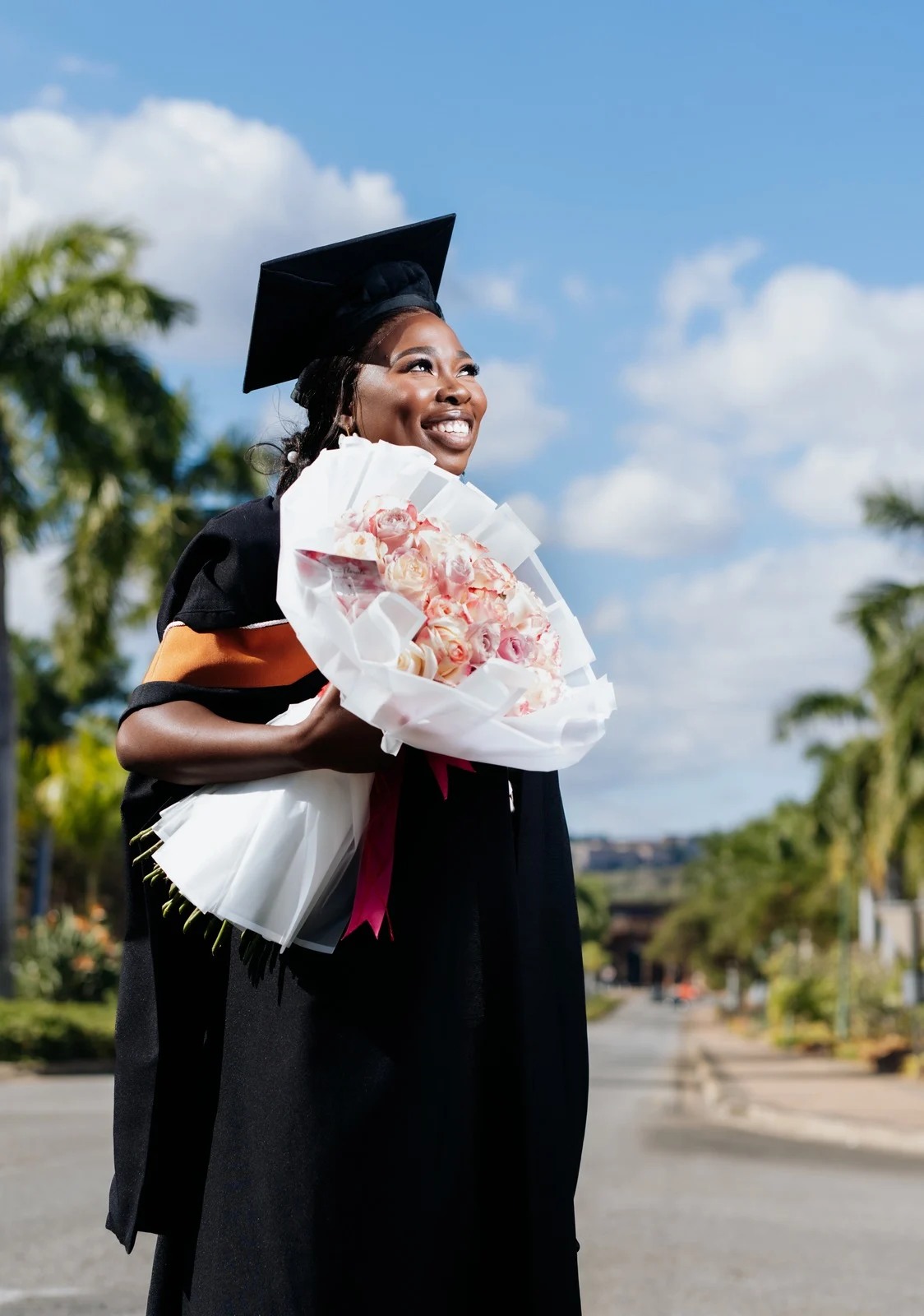 Graduation portrait with flowers
